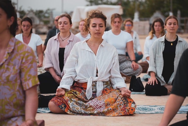 alt= "A group of women embracing meditation in their lives"