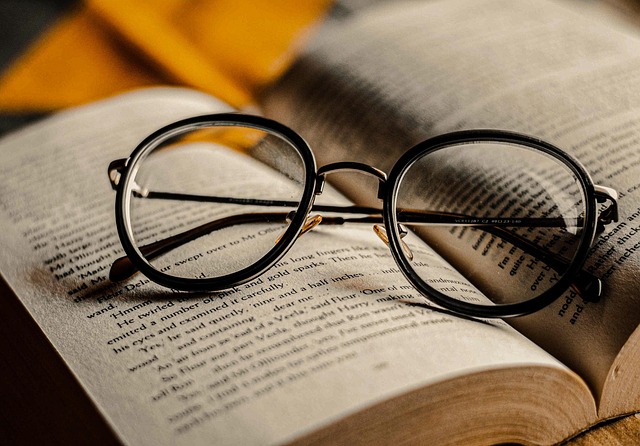 Alt=" Open book with glasses on them to represent being between chapters in your life."